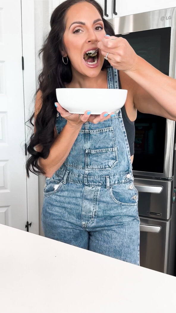 eating a salad wearing overalls