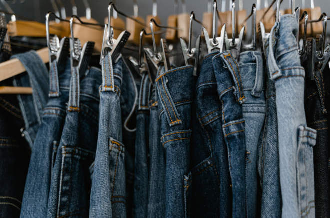 Women's jeans hanging on a clothes rack