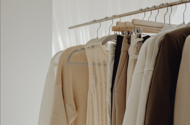A decluttered closet with matching hangers and organized sections.