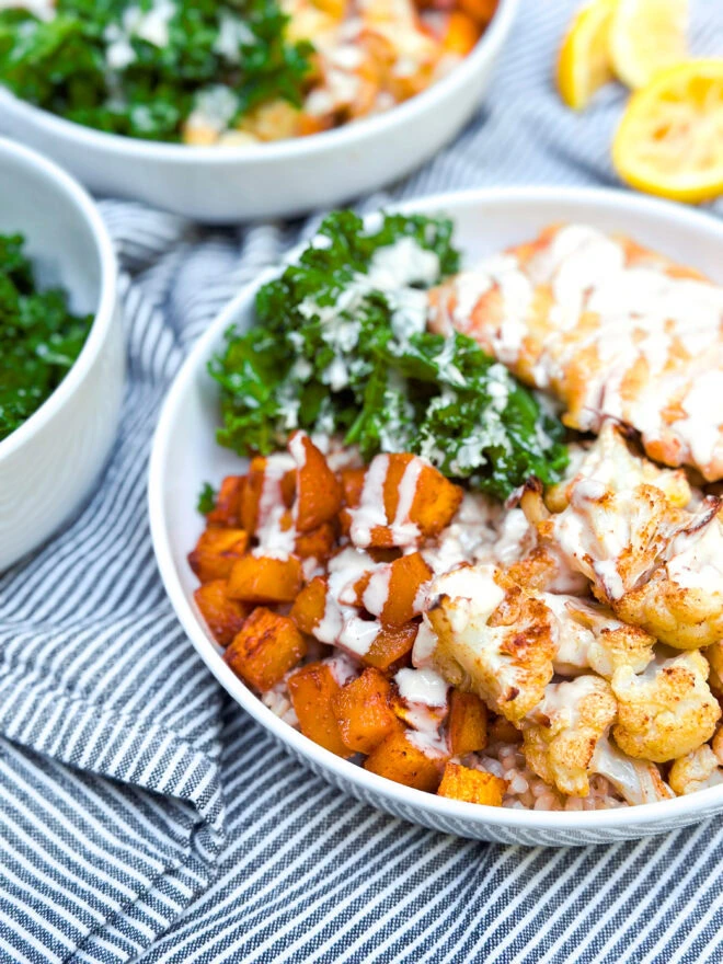 Crispy Chicken Thigh Power Bowls with Roasted Veggies & Lemon-Tahini Dressing